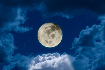 Naklejka na ściany i meble Big bright and shining full moon against a dark night sky dramatic seen through a hole in the clouds. Elements of this image furnished by NASA