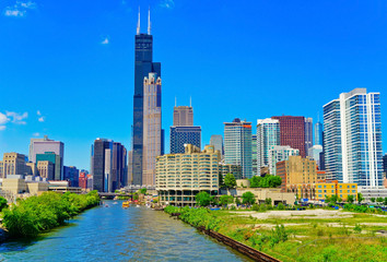 View of the Chicago River with the skyline of Chicago on a sunny day.