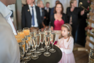 Wedding agape serving champagne and orange juice