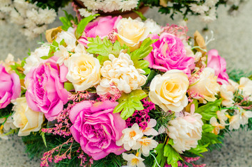 rosal wreath on grave during All Saints Day in the cemetery