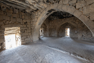 Fototapeta na wymiar Castle Qazr Al-Azraq - one of the Jordan desert castles. Used by Lawrence of Arabia as a base during the Arab Revolt. Interior of the tower