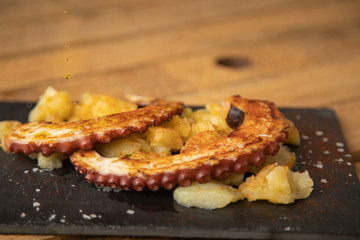 Octopus with paprika, potatoes and olive oil is a typical tapa from Galicia, Spain