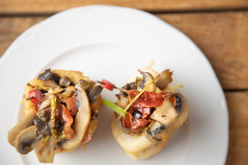 typical spanish tapa se bacon and squid mushrooms