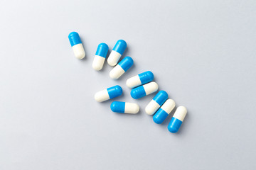 Tri-Creatine Malate capsules. Sports supplements on bright paper background. Top view. Copy space.