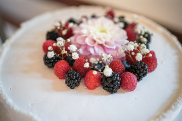 White wedding cake with berries
