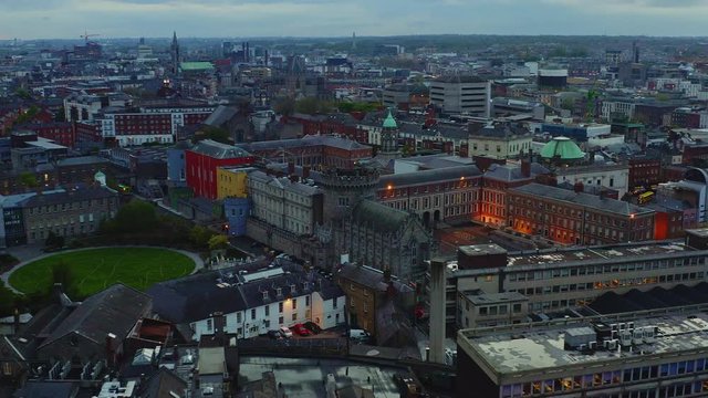 Aerial orbiting around Dublin Castle and Dubh Linn Garden at blue hour