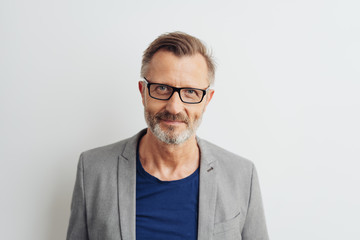 Bearded middle-aged man in glasses - obrazy, fototapety, plakaty