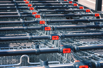 Shopping carts in the store, assembled in a row in the parking lot. Close-up.