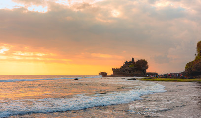 Tanah Lot Temple at sunset - Most important hindu temple of Indonesia - Bali, Indonesia.