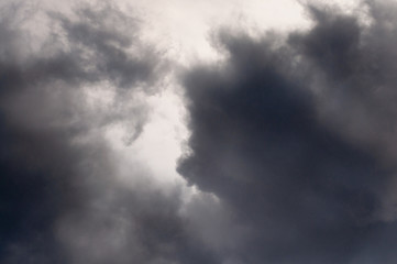 Clouds and sky. The rays of the sun in the gaps between the curly clouds. the sky before the rain. The sky after the rain.