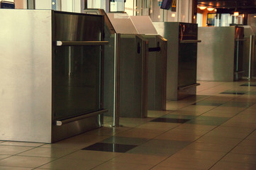 An exit counter to airplanes at the airport. Closed, red signal. Airport equipment. Organization of passenger traffic at the airport. Checkpoint at the airport.