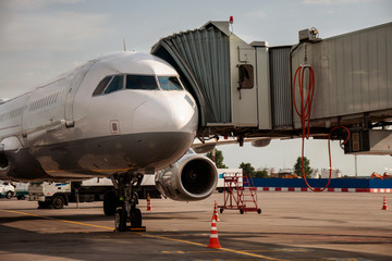 Teletrap connected to the aircraft. telescopic ladder is connected to taircraft. airport engineering systems . Boarding and disembarking passengers from an airplane. sleeve is connected to aircraft.