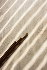 Fototapeta na wymiar Metal straws in sun on wooden background. Zero waste. Flat lay 