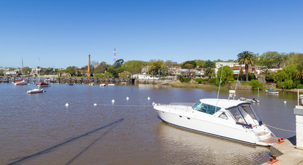 Fototapeta premium Boats anchored in the port of the city of Colonia del Sacramento, Uruguay, on the Rio de la Plata. Colonia del Sacramento is one of the oldest cities in Uruguay.