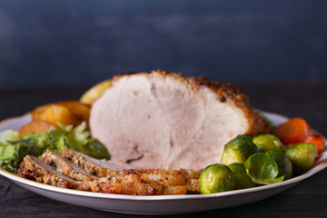 Roasted sliced ham and vegetables. Room for text