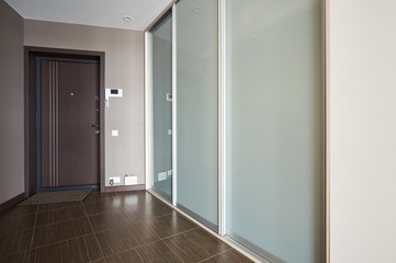 entrance hall with large wardrobe with glass doors