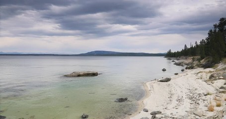 Yellowstone Lake Shore West Thumb Geyser Basin water. Geothermal ecosystem environment. Caldera super volcano. Biology geography and ecology. Millions of tourist and visitors.