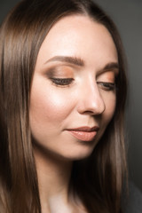 Naklejka premium Beauty face portrait of young woman on a black background