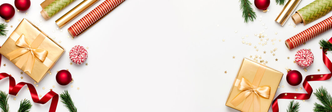 Flat lay Xmas holiday 2020 celebration. New Year Christmas golden presents with ribbon red Christmas balls pine branches gold confetti stars on gray background top view. Gift boxes Festive decorations