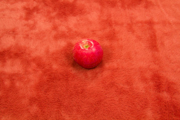 Still life Apples on red fur.