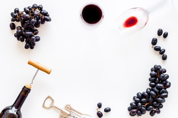 Frame with red wine bottle. Top view white background copy space