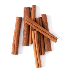 Cinnamon sticks isolated on white background closeup. Canella spice. Aromatic condiment background. Flat lay, top view.