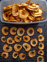 Dried slices of red and yellow dehydrated apples