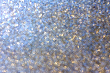 Shining sparkling background with bokeh. Festive, Christmas background with strong blur 