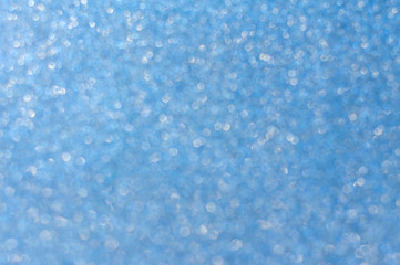 Sparkling sparkling, festive, Christmas background gently blue with the transition to a strong blur. Much razlomanny Christmas background with bokeh .