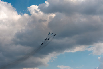 military aircraft flying in the background of clouds