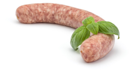 Raw sausage with basil leaf isolated on white background