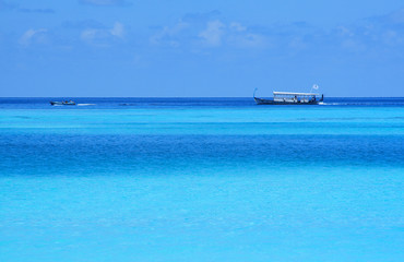Two boats in the blue waters of Indian Ocean