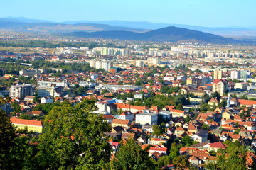 Fototapeta na wymiar Aerial view. Racadau cvartal in south of the city Brasov, Transylvania. Typical urban landscape. Brasov is the center of Romania
