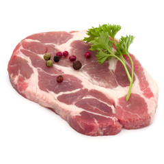Raw pork neck chop meat with parsley herb leaves and peppercorn spices garnish isolated on white background cutout