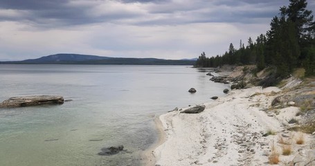 Yellowstone Lake Shoreline West Thumb Geyser Basin water. Geothermal ecosystem environment. Caldera super volcano. Biology geography and ecology. Millions of tourist and visitors.