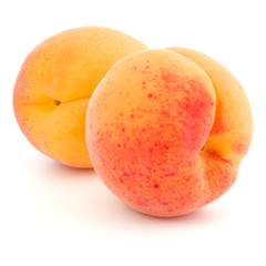 Two apricot fruit isolated on white background cutout