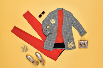 Autumn Arrives. Fashion Lady Clothes fall Outfit. Trendy jacket, red trousers. Stylish Handbag,...