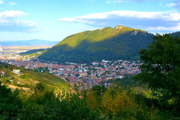 Fototapeta na wymiar Aerial view. Typical urban landscape of the city Brasov, a town situated in Transylvania, Romania, in the center of the country. 