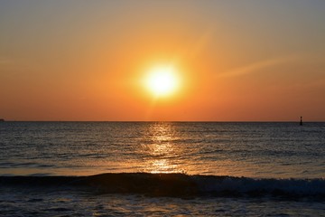 Fototapeta na wymiar a beautiful sunrise at the seashore