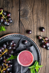 Seasonal homemade drink, freshly made grape juice in glass jar with copy space