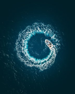 Aerial view of boat moving in sea