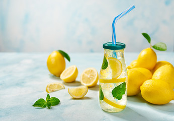 Homemade lemonade  on a light background, cold refreshing drink .