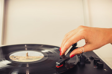 girl playing music on vinyl turntables