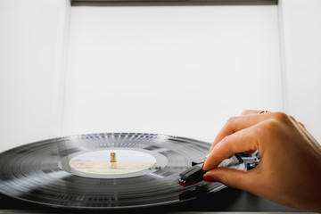 girl playing music on vinyl turntables