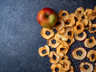 Naklejka premium background of dried sliced apples, healthy snack concept
