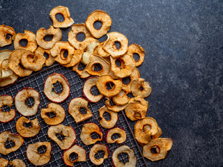 Naklejka premium background of dried sliced apples, healthy snack concept