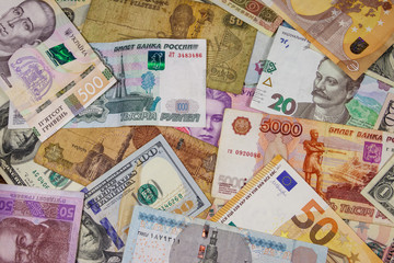 Multicurrency background of euros US dollars, Russian rubles, Egyptian pounds and Ukrainian hryvnias