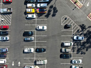 Aerial top view of parking lot with cars