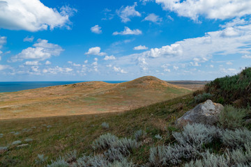 Desert hilly landscape with rocks on foreground