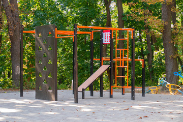 Playground in the park. Children`s playground with children's sports complex in municipal park